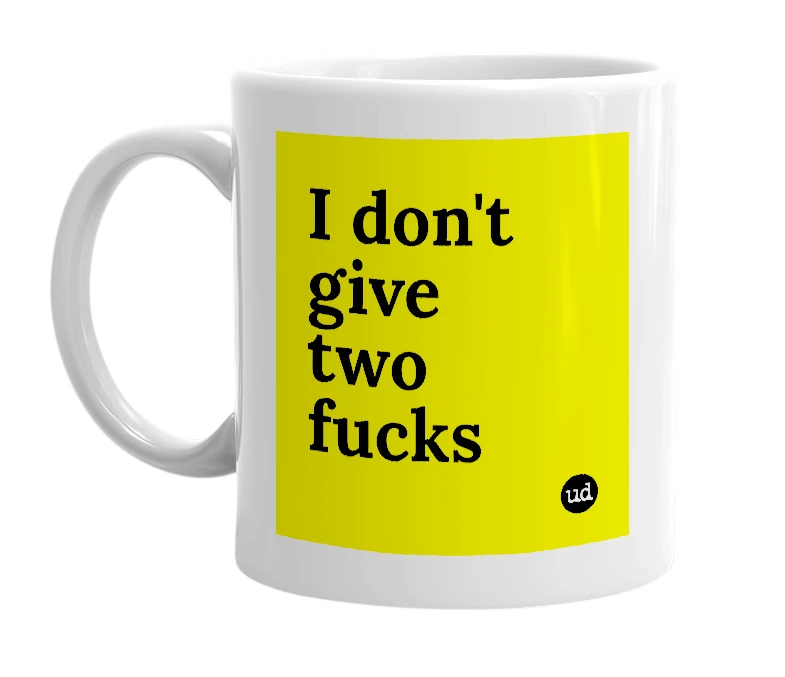 White mug with 'I don't give two fucks' in bold black letters