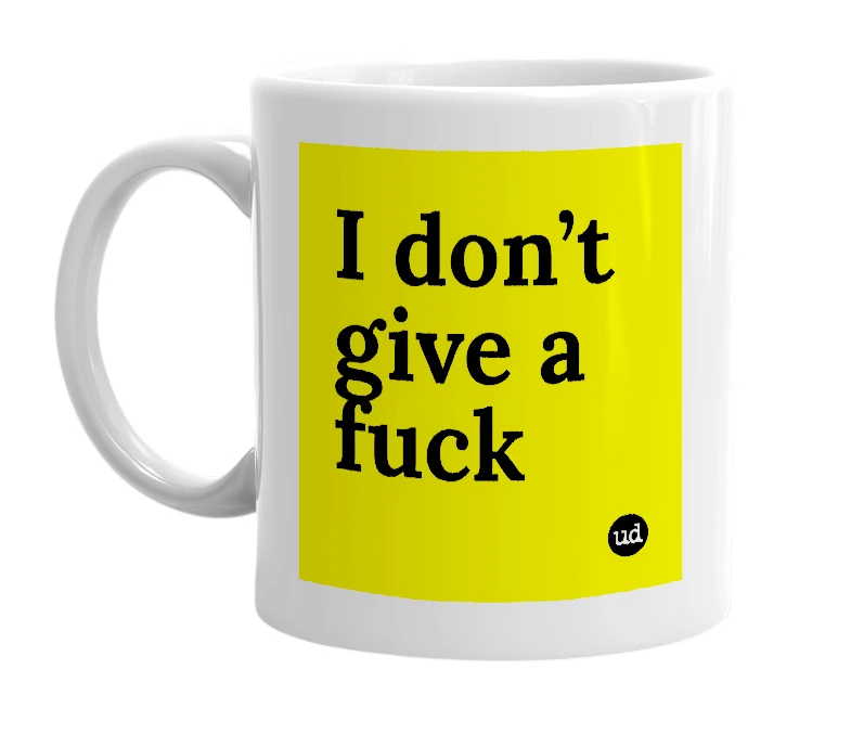 White mug with 'I don’t give a fuck' in bold black letters