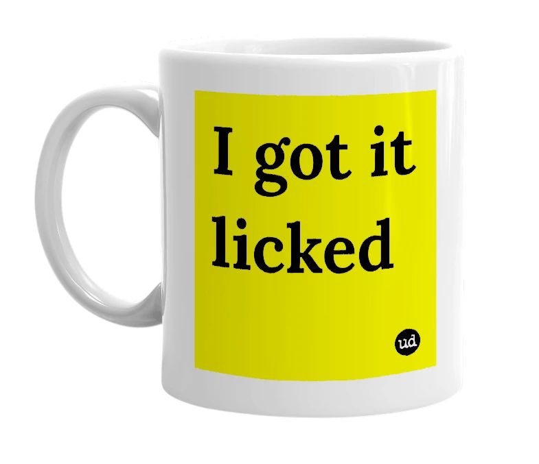 White mug with 'I got it licked' in bold black letters