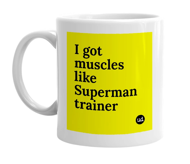White mug with 'I got muscles like Superman trainer' in bold black letters