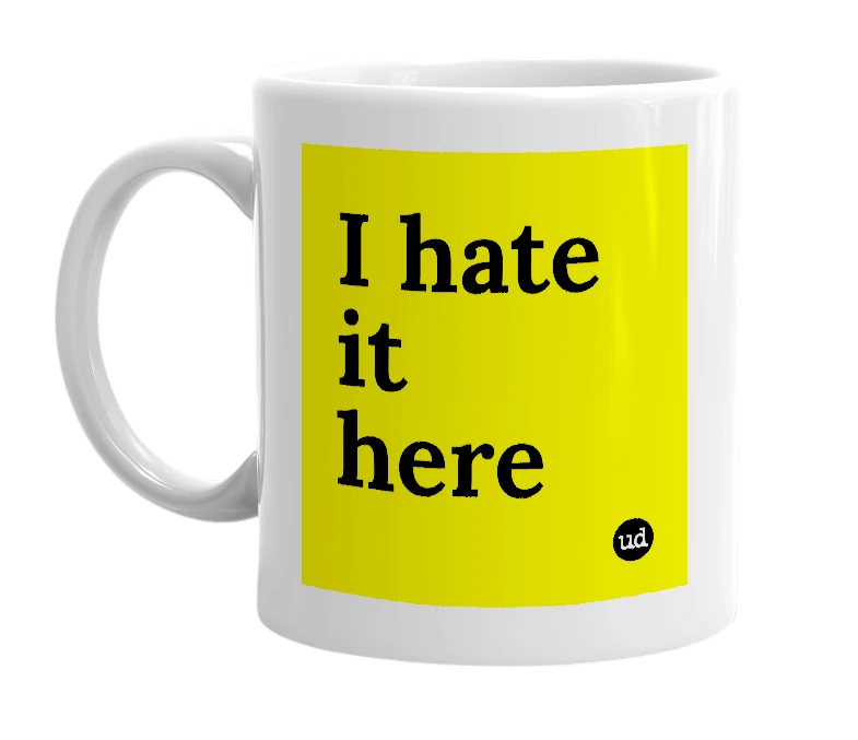 White mug with 'I hate it here' in bold black letters