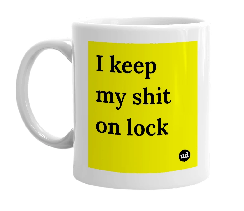 White mug with 'I keep my shit on lock' in bold black letters