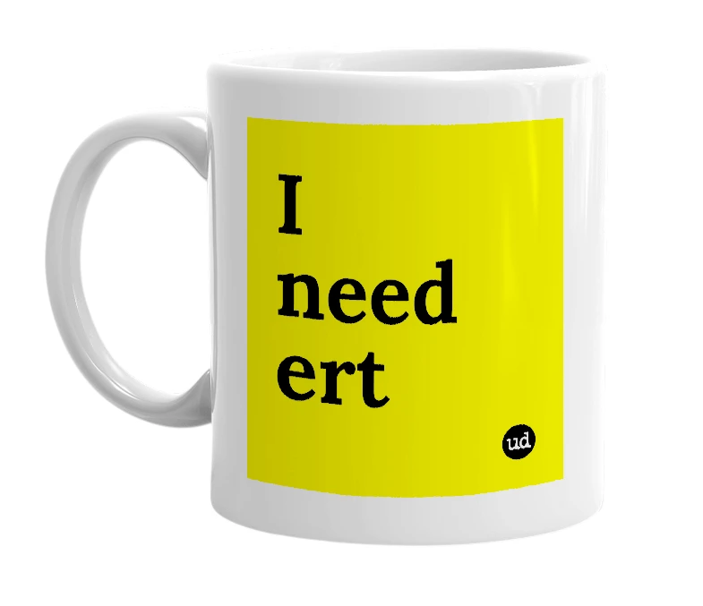 White mug with 'I need ert' in bold black letters