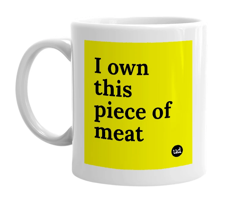 White mug with 'I own this piece of meat' in bold black letters