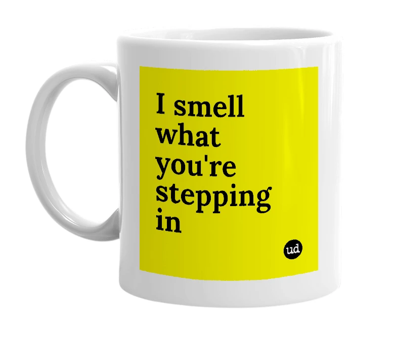 White mug with 'I smell what you're stepping in' in bold black letters