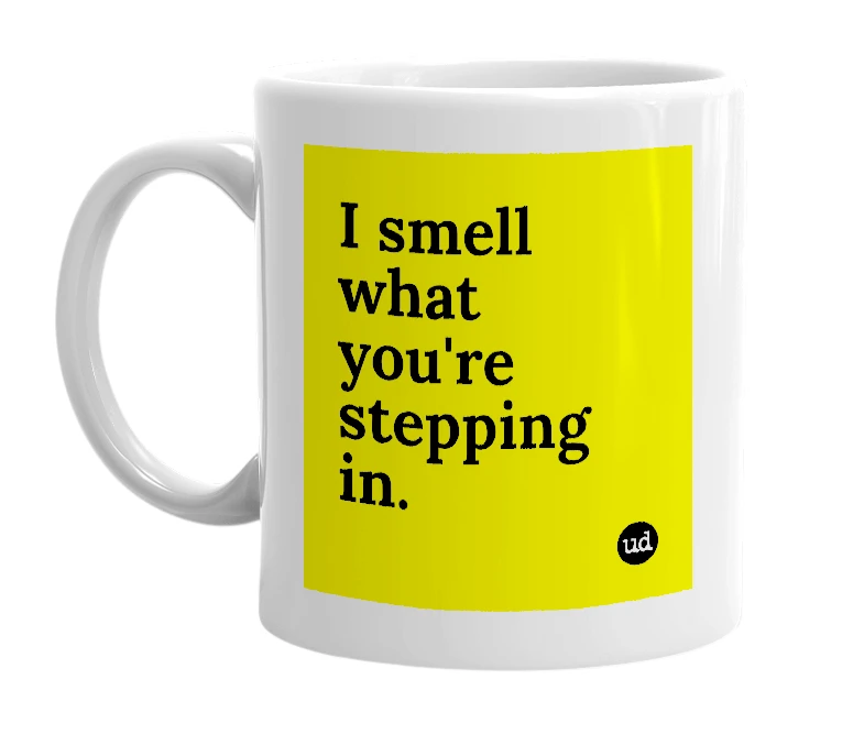 White mug with 'I smell what you're stepping in.' in bold black letters