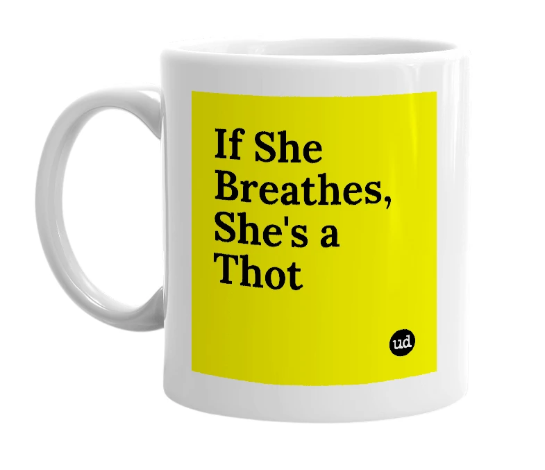 White mug with 'If She Breathes, She's a Thot' in bold black letters