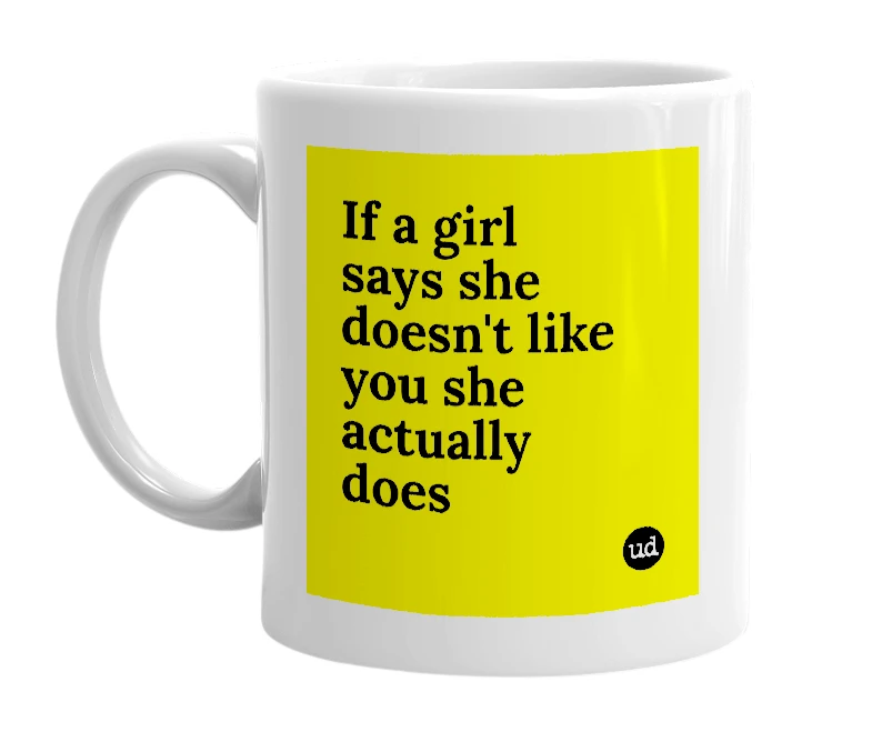 White mug with 'If a girl says she doesn't like you she actually does' in bold black letters