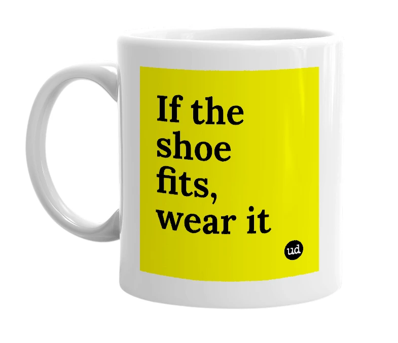 White mug with 'If the shoe fits, wear it' in bold black letters