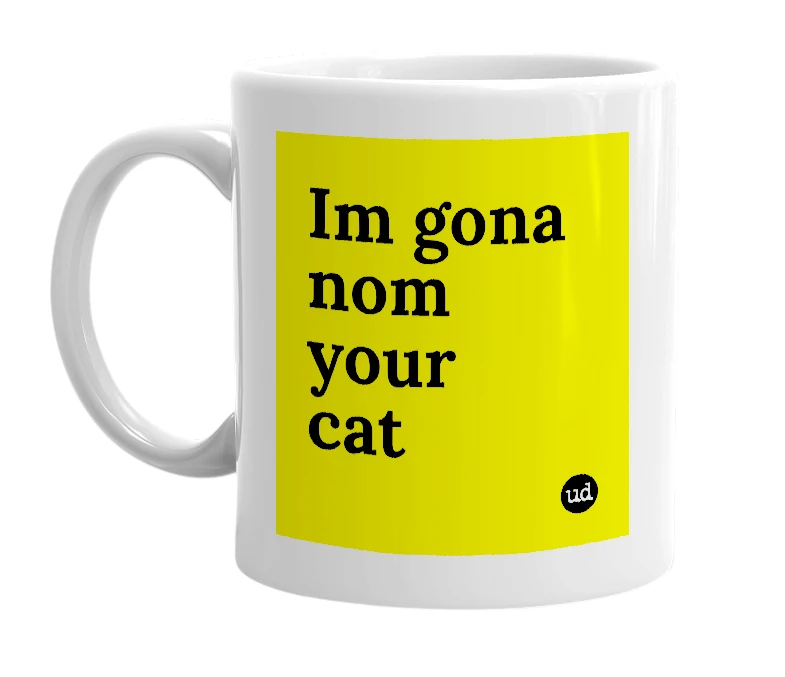 White mug with 'Im gona nom your cat' in bold black letters