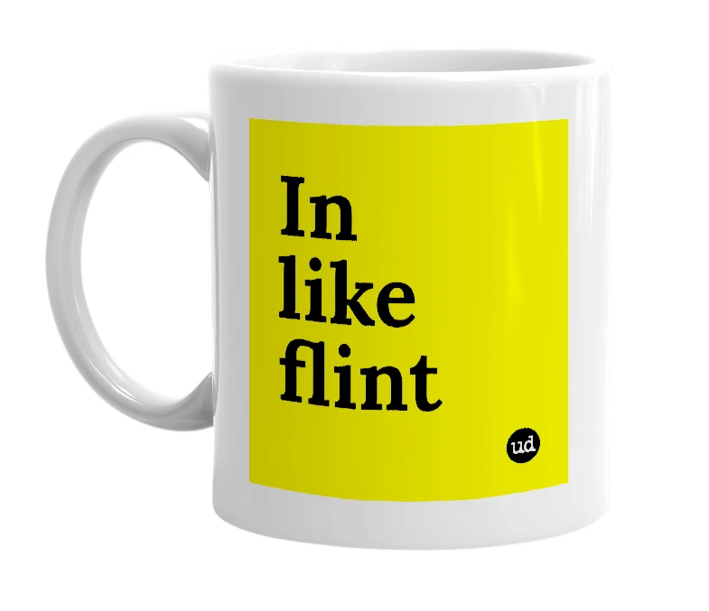White mug with 'In like flint' in bold black letters
