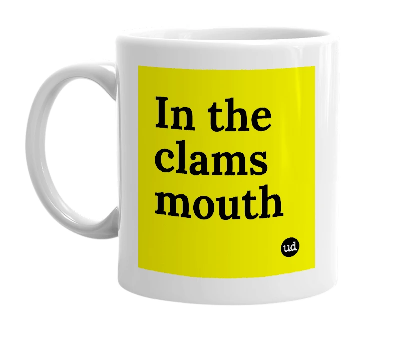 White mug with 'In the clams mouth' in bold black letters