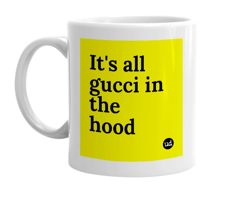 White mug with 'It's all gucci in the hood' in bold black letters