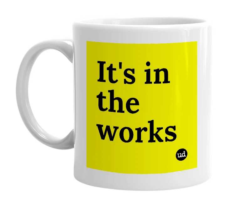 White mug with 'It's in the works' in bold black letters