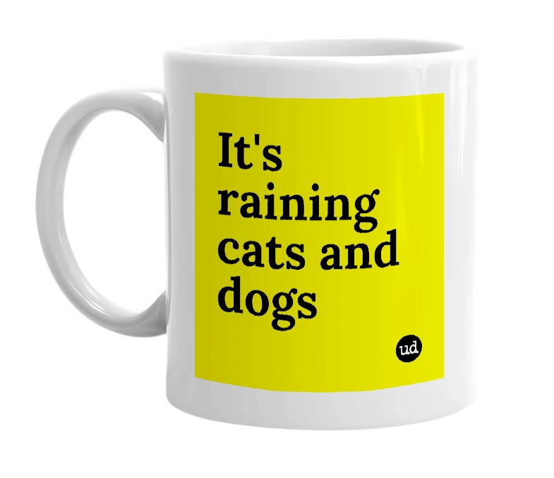 White mug with 'It's raining cats and dogs' in bold black letters