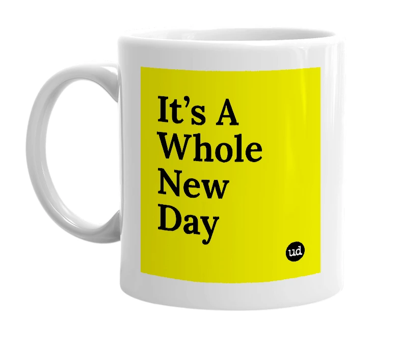 White mug with 'It’s A Whole New Day' in bold black letters