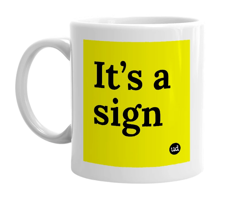 White mug with 'It’s a sign' in bold black letters