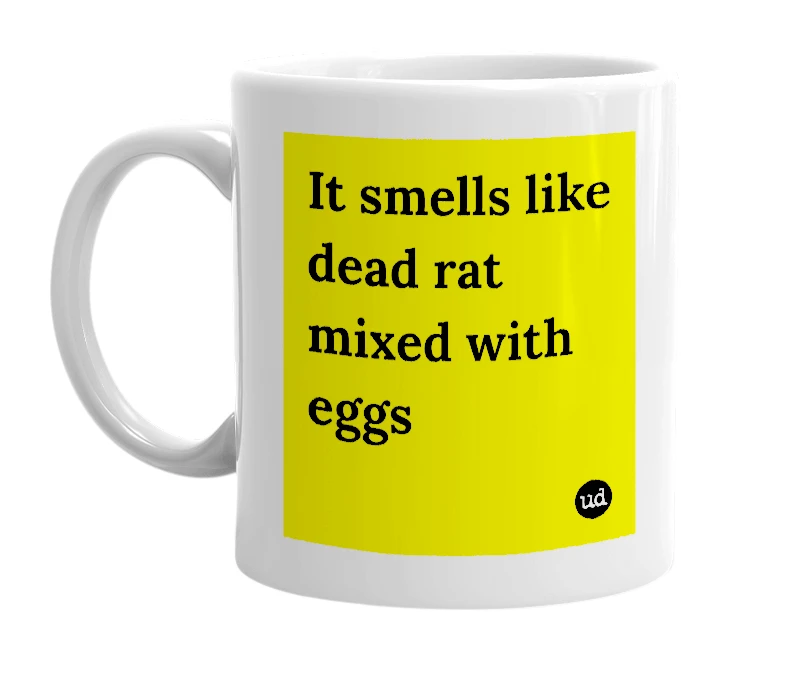 White mug with 'It smells like dead rat mixed with eggs' in bold black letters