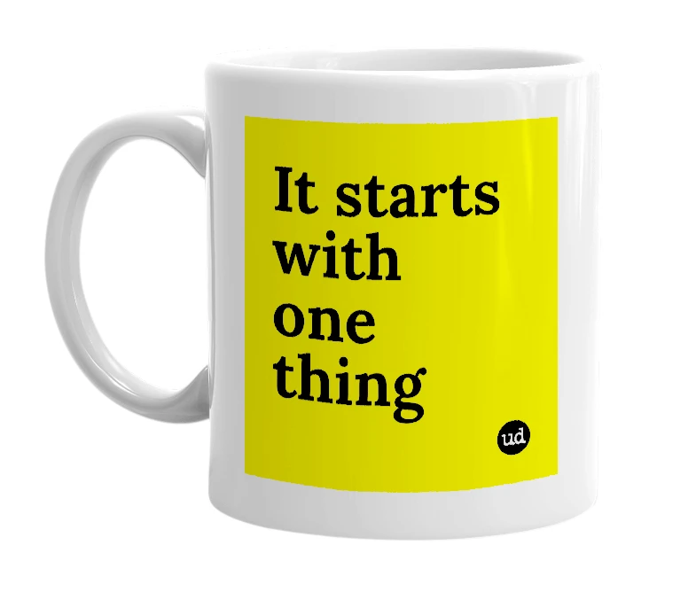 White mug with 'It starts with one thing' in bold black letters