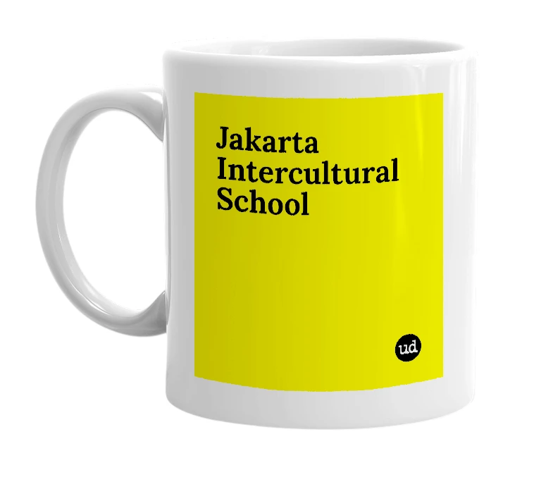 White mug with 'Jakarta Intercultural School' in bold black letters