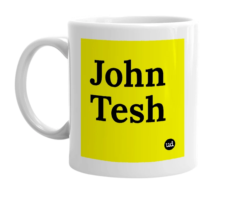 White mug with 'John Tesh' in bold black letters
