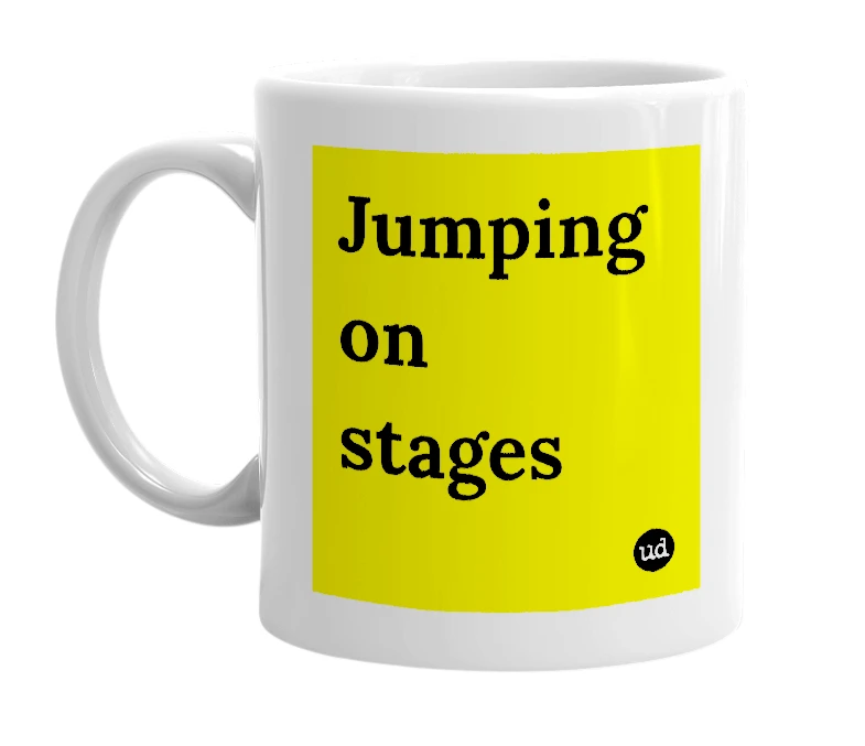 White mug with 'Jumping on stages' in bold black letters