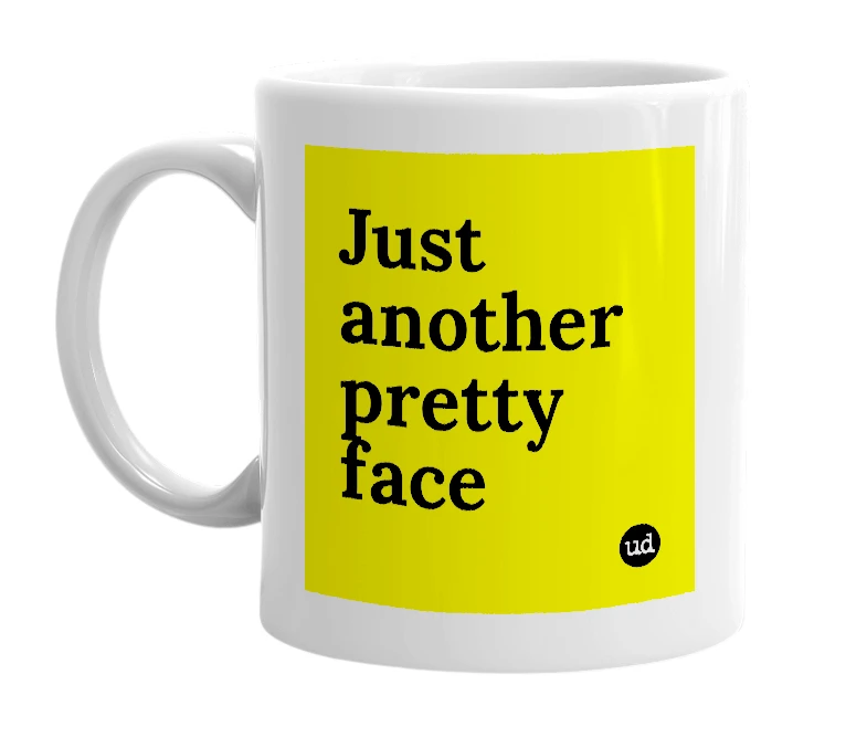 White mug with 'Just another pretty face' in bold black letters