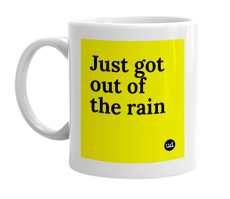 White mug with 'Just got out of the rain' in bold black letters