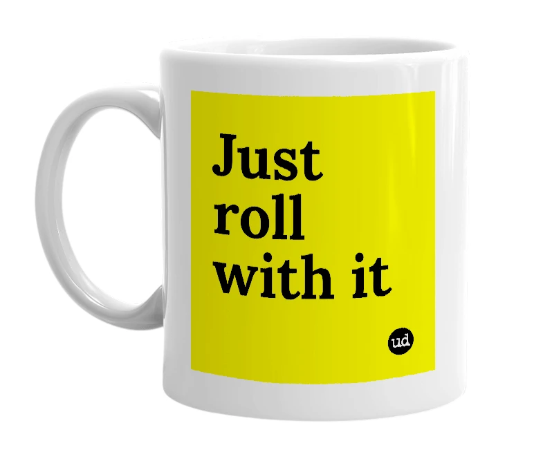 White mug with 'Just roll with it' in bold black letters
