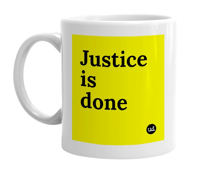 White mug with 'Justice is done' in bold black letters