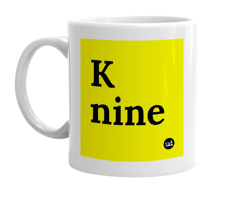 White mug with 'K nine' in bold black letters