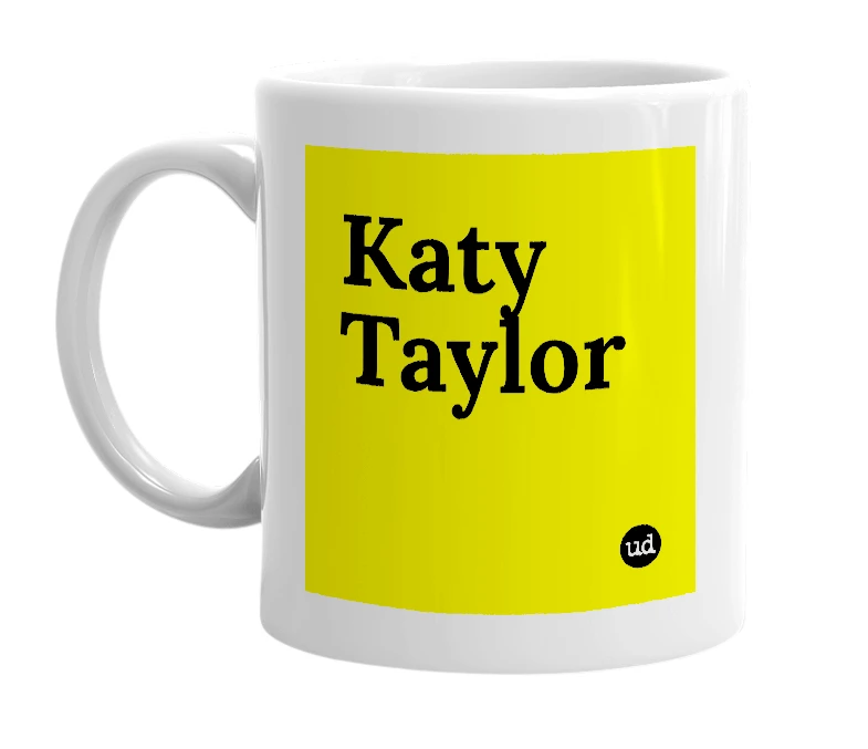 White mug with 'Katy Taylor' in bold black letters