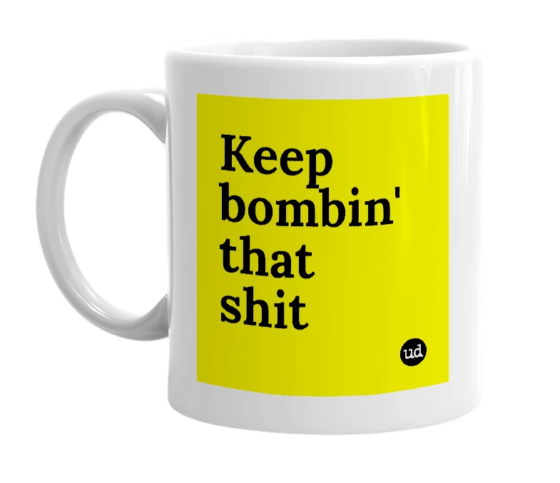 White mug with 'Keep bombin' that shit' in bold black letters