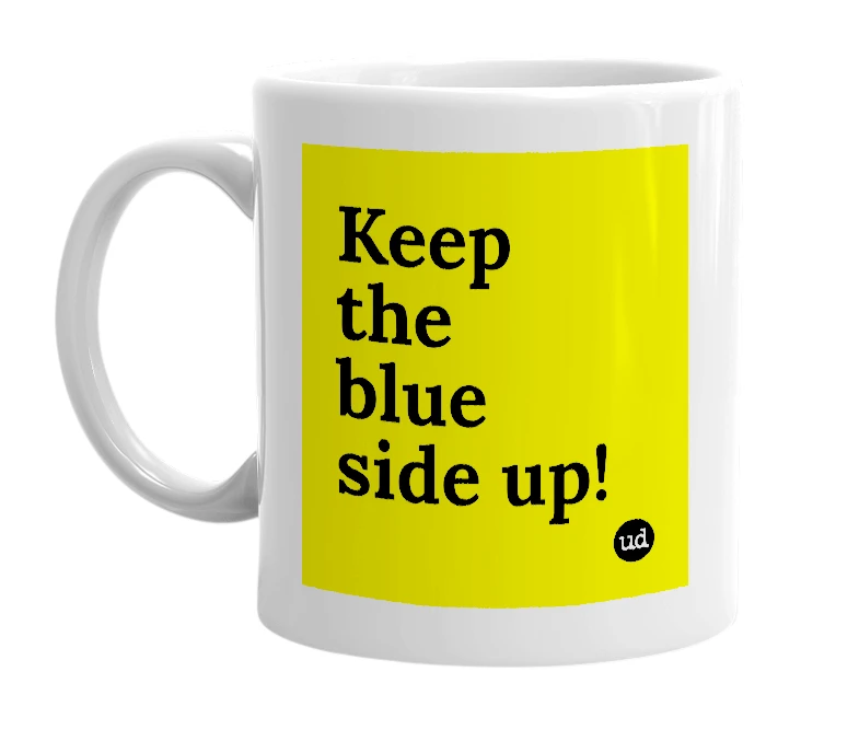 White mug with 'Keep the blue side up!' in bold black letters