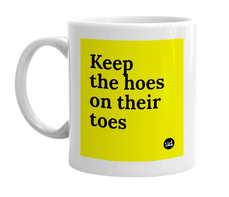 White mug with 'Keep the hoes on their toes' in bold black letters