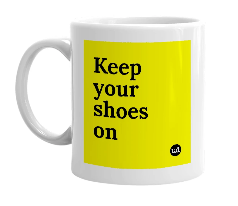 White mug with 'Keep your shoes on' in bold black letters