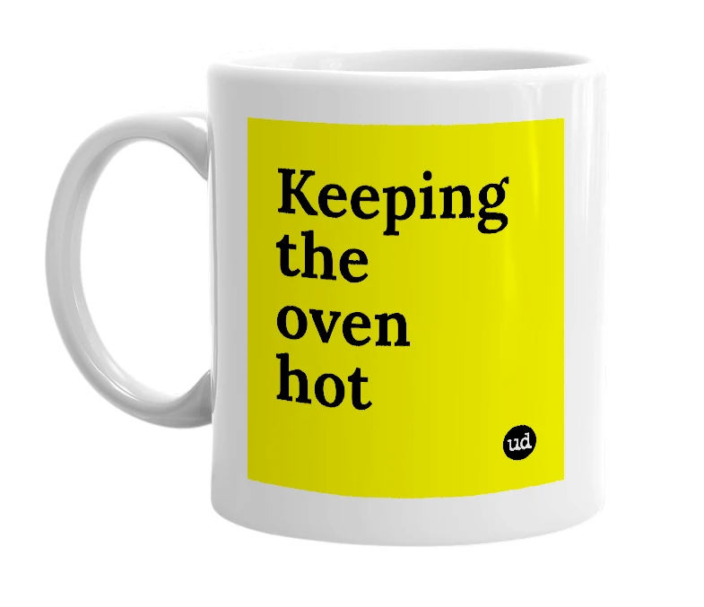 White mug with 'Keeping the oven hot' in bold black letters