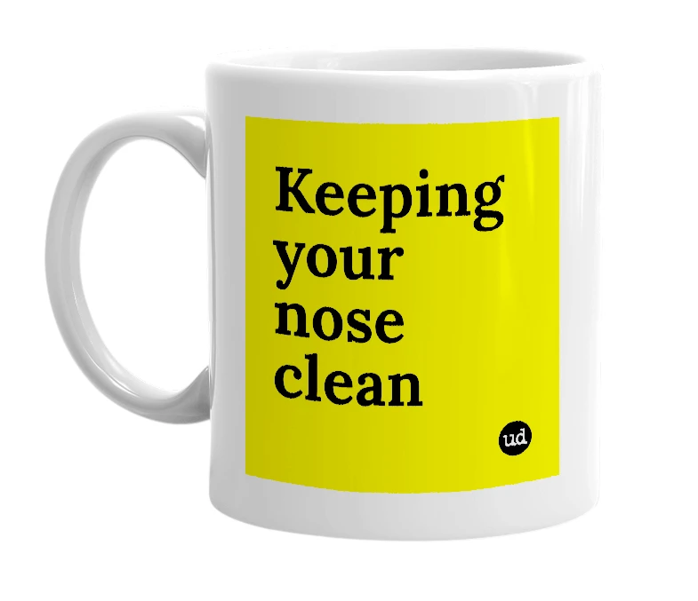 White mug with 'Keeping your nose clean' in bold black letters