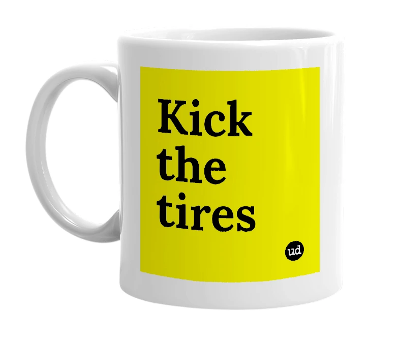White mug with 'Kick the tires' in bold black letters