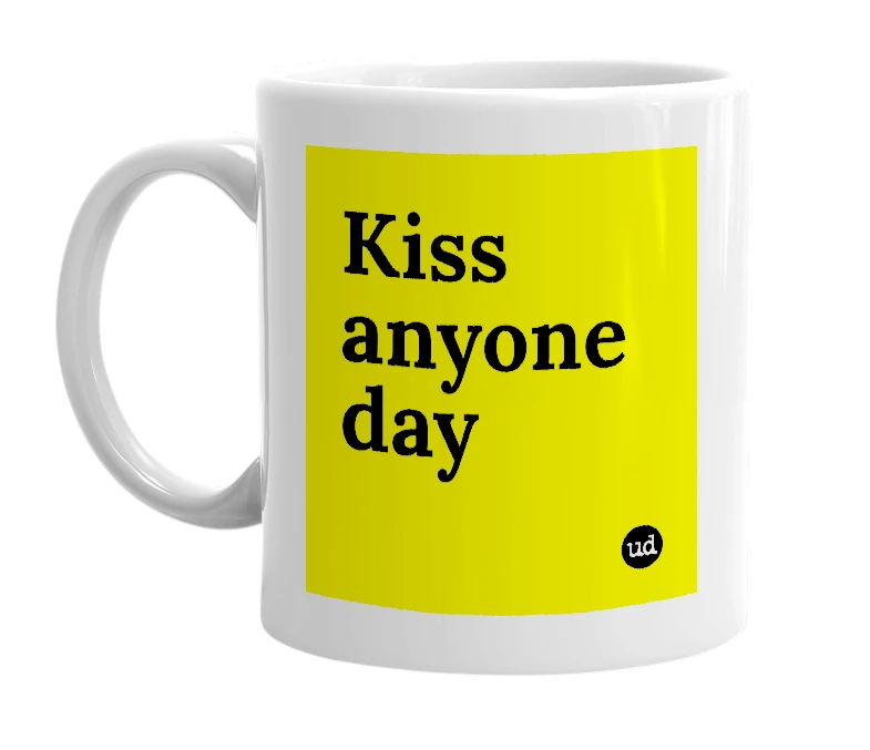 White mug with 'Kiss anyone day' in bold black letters