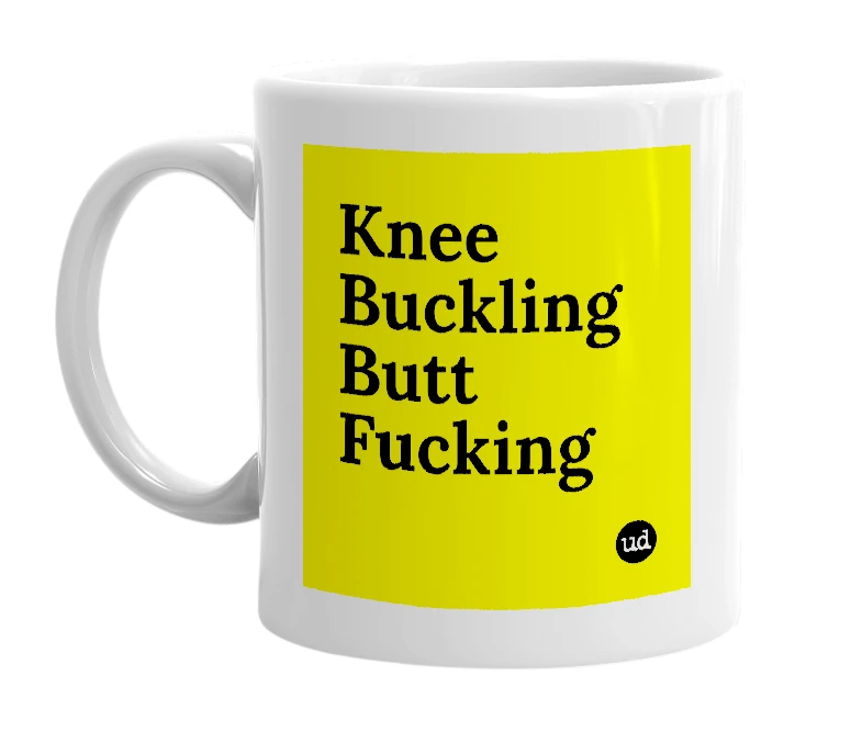 White mug with 'Knee Buckling Butt Fucking' in bold black letters