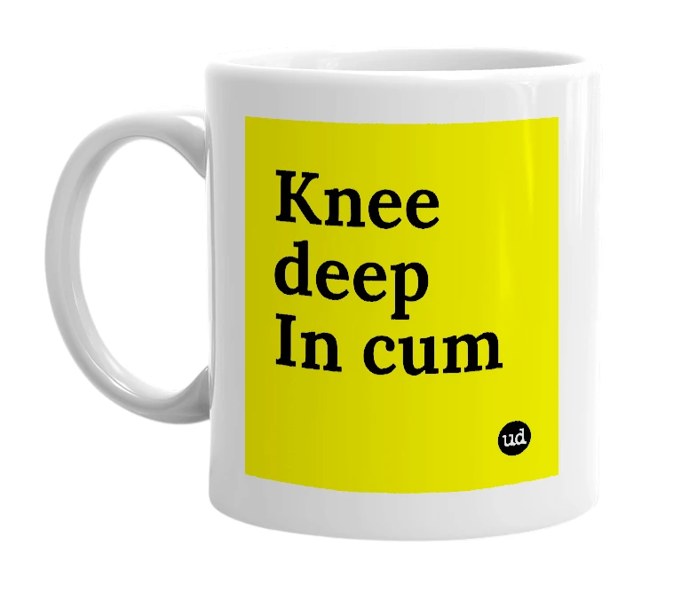 White mug with 'Knee deep In cum' in bold black letters