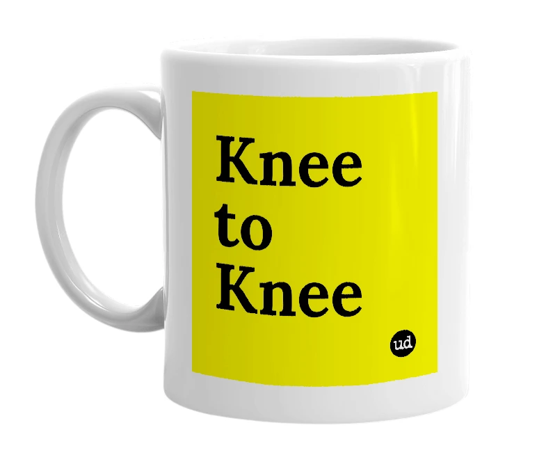 White mug with 'Knee to Knee' in bold black letters