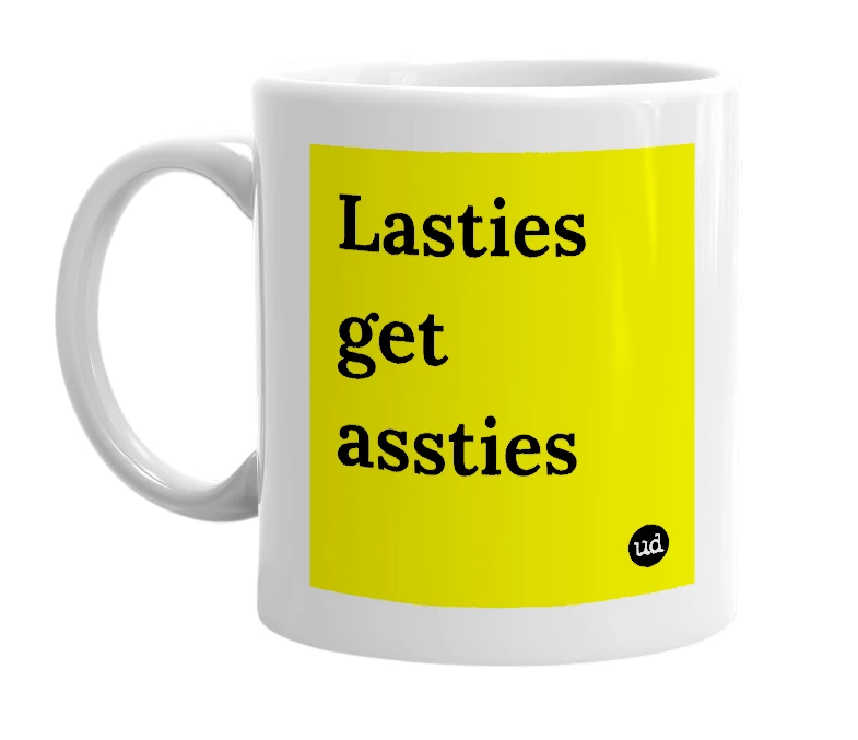 White mug with 'Lasties get assties' in bold black letters
