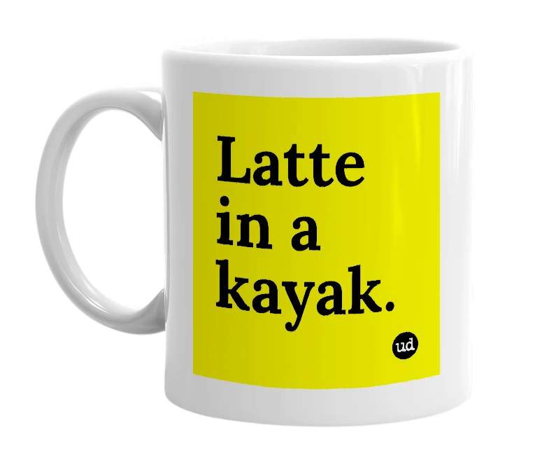 White mug with 'Latte in a kayak.' in bold black letters