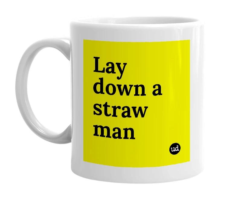 White mug with 'Lay down a straw man' in bold black letters