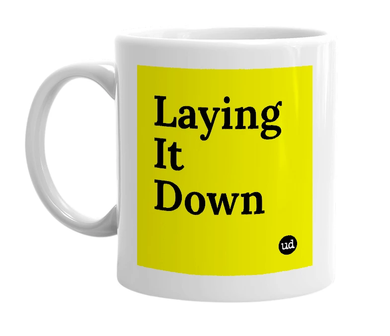 White mug with 'Laying It Down' in bold black letters