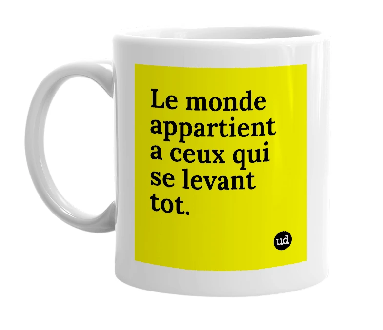 White mug with 'Le monde appartient a ceux qui se levant tot.' in bold black letters