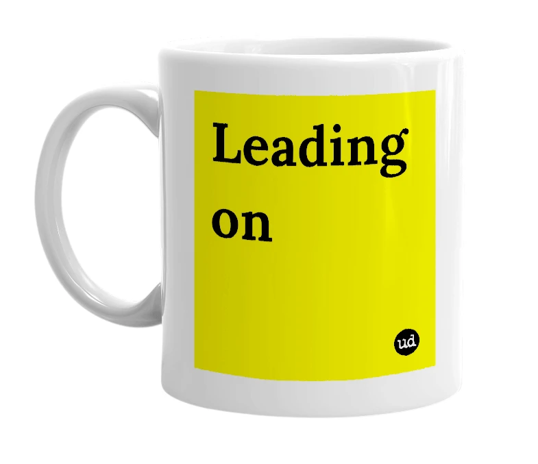 White mug with 'Leading on' in bold black letters