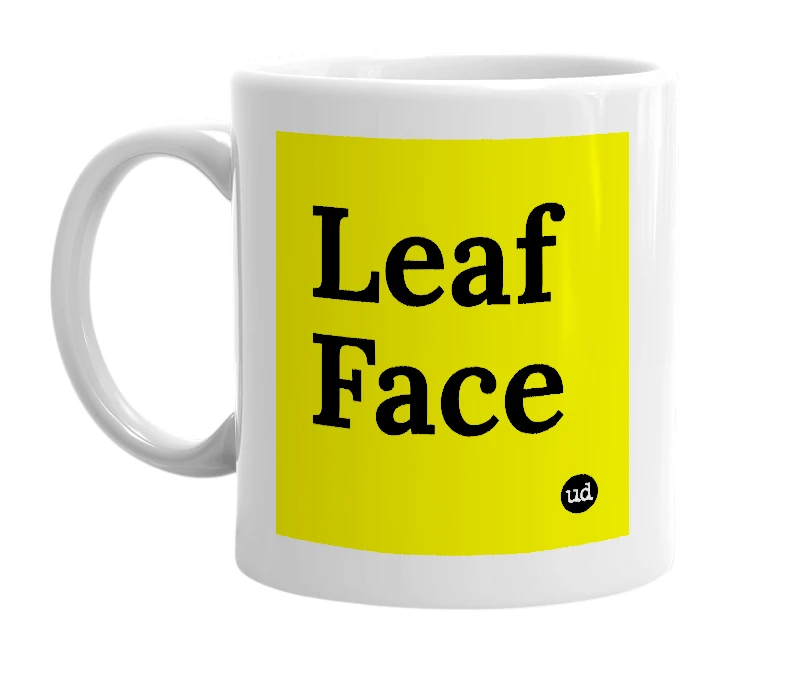 White mug with 'Leaf Face' in bold black letters